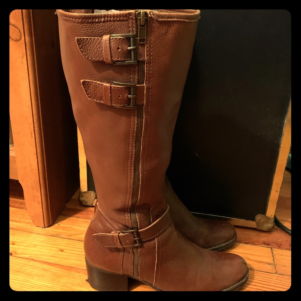 Dark chestnut tall boots with buckle detail.
